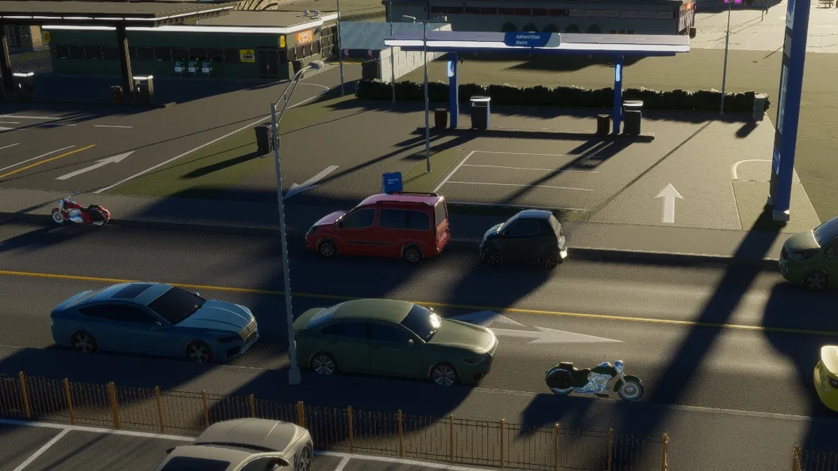 Several multicolored cars and two motorcycles are parked on the side of the street in Cities: Skylines 2.